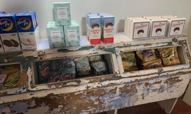 Old wooden display with vintage-style snack boxes and packages.