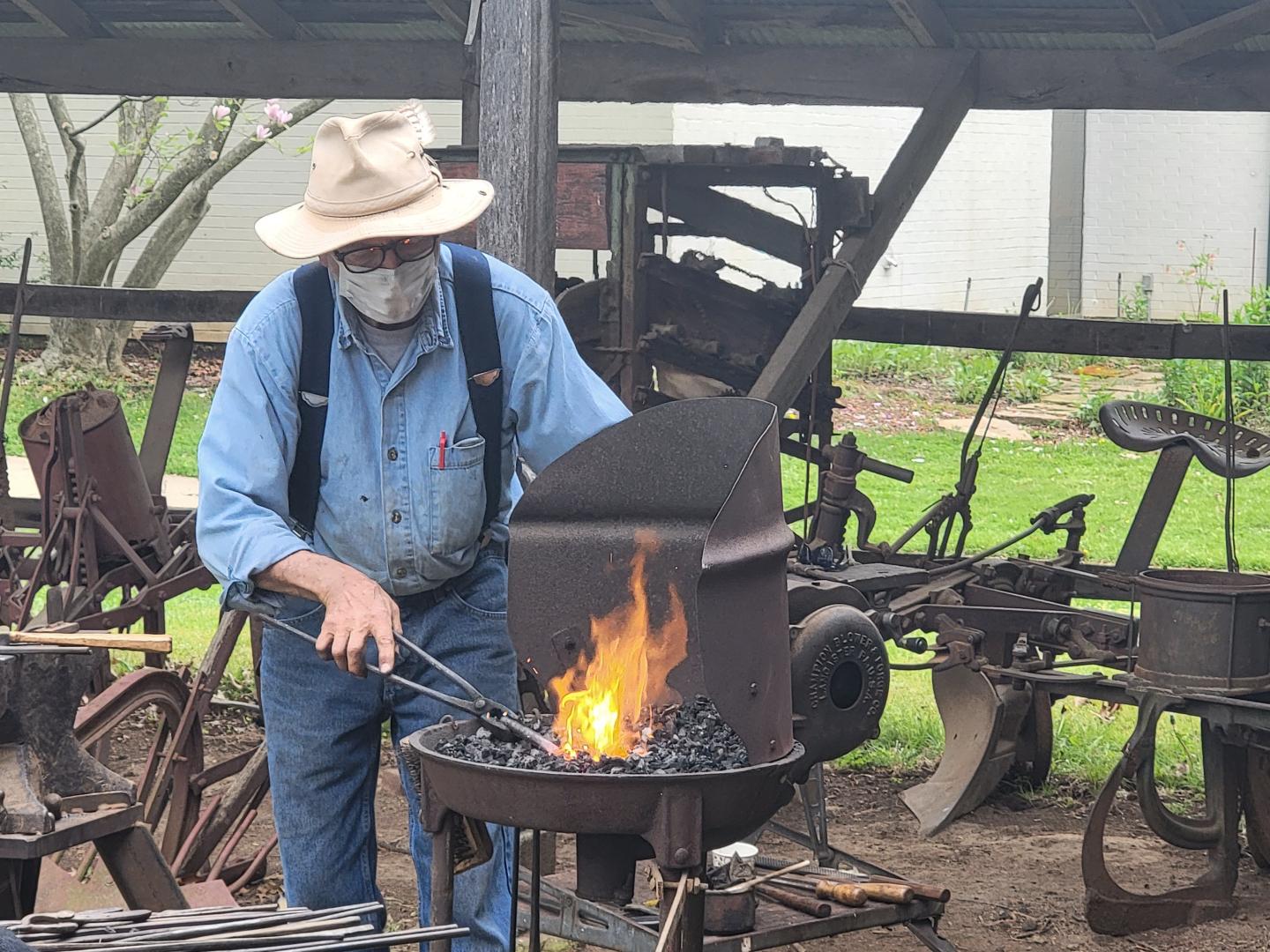 Shiloh's programs include visiting artisans, such as this blacksmith shown here.