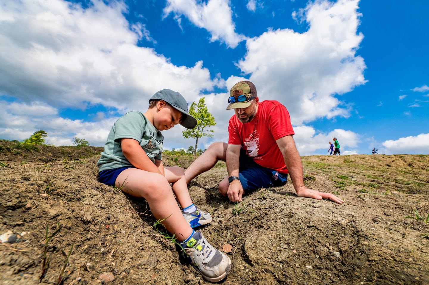 Father and son digging for diamonds.