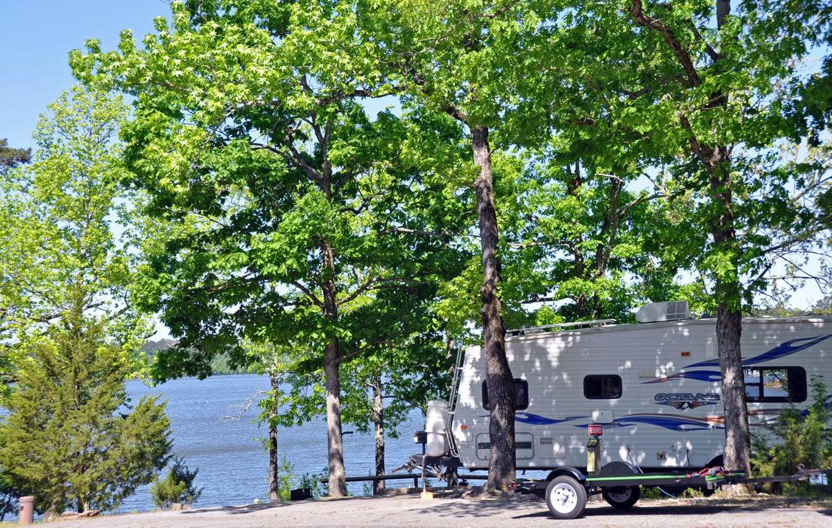 Camp right on the crystal clear Lake Greeson at Daisy State Park