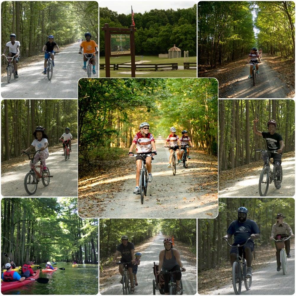 Cyclists and kayakers in a wooded park setting.