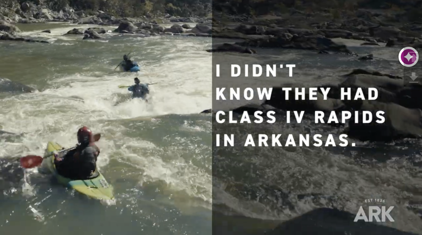 Kayakers navigating rapids in a rocky river.