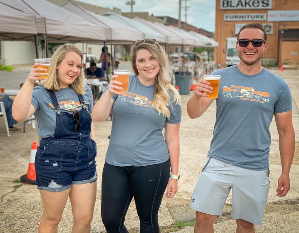 Friends cheering at Flyway Brewing