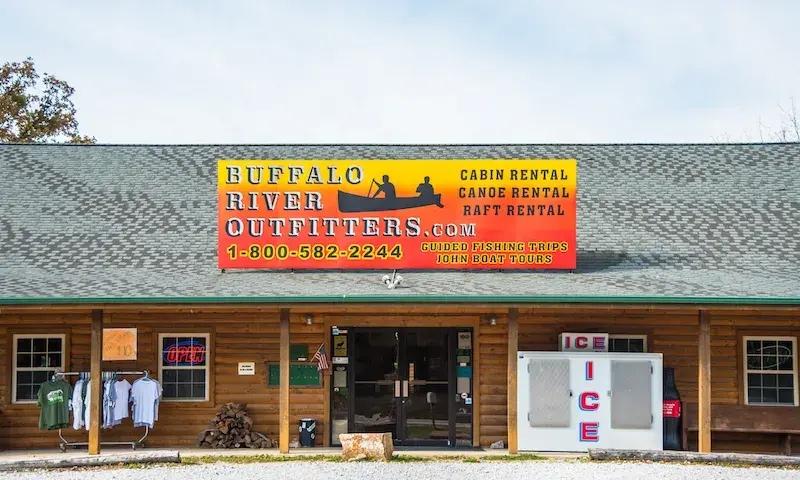 Outdoor store with a wooden facade and colorful signage.