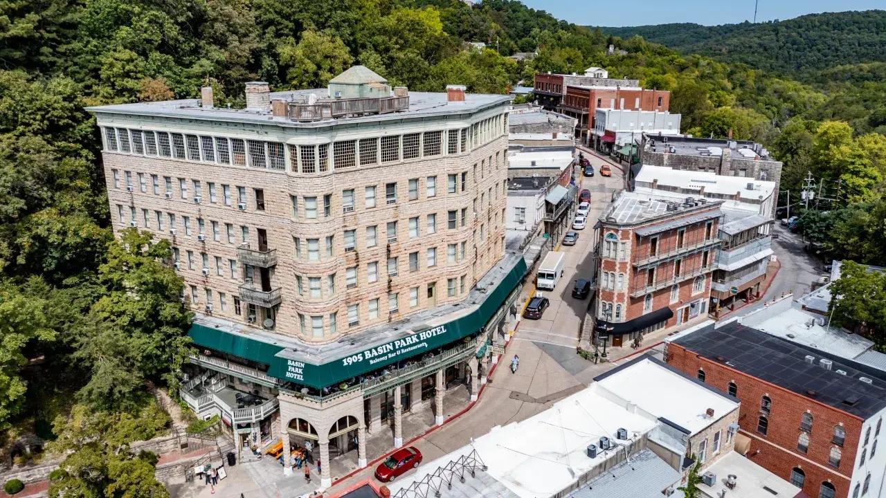 Historic hillside town with winding streets and lush greenery.